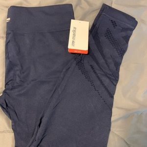 NWT 7/8th Navy leggings with laser cutouts.
